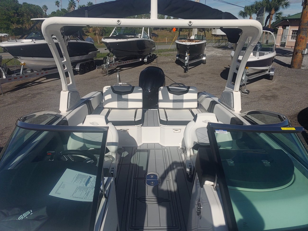 The definition of an outboard motor is a detachable engine mounted on outboard brackets on the stern of your boat.  This configuration will have only one single engine.