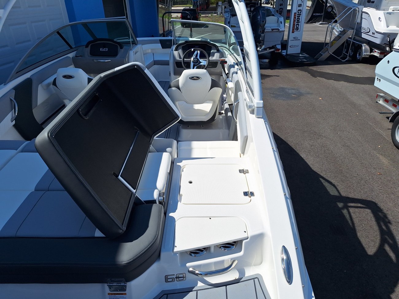 The definition of an outboard motor is a detachable engine mounted on outboard brackets on the stern of your boat.  This configuration will have only one single engine.