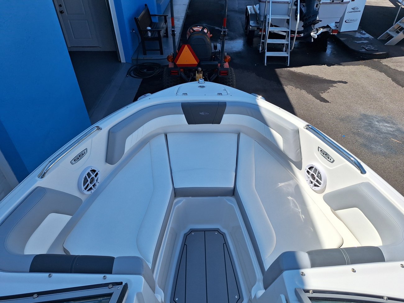 The definition of an outboard motor is a detachable engine mounted on outboard brackets on the stern of your boat.  This configuration will have only one single engine.