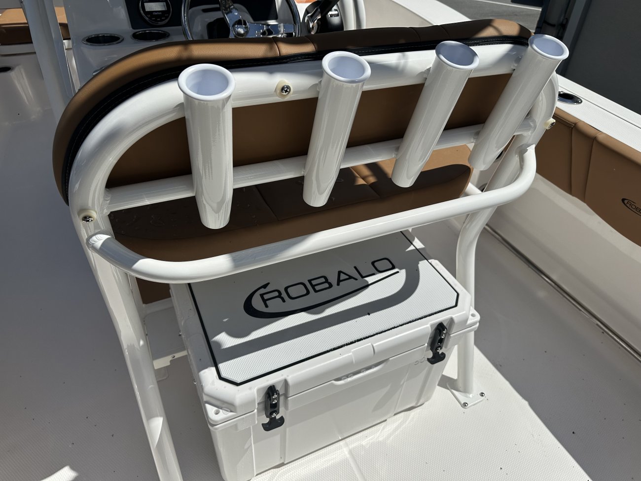 The definition of an outboard motor is a detachable engine mounted on outboard brackets on the stern of your boat.  This configuration will have only one single engine.